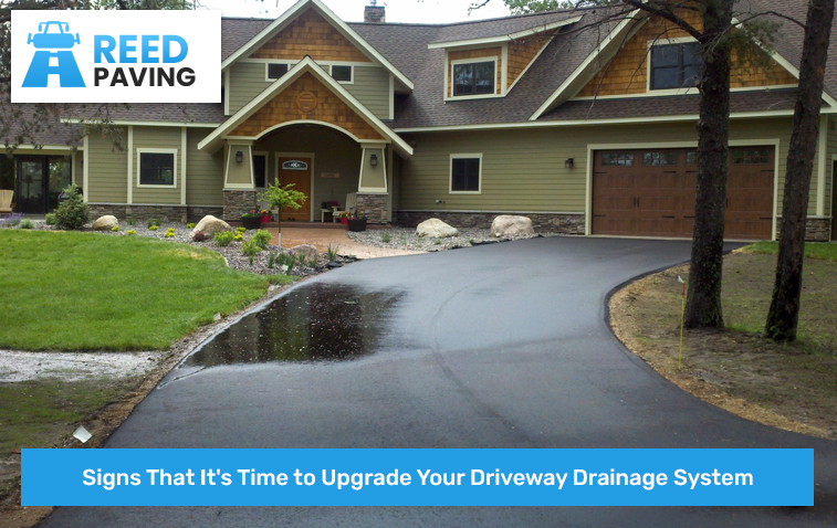 Driveway with stagnant water indicating drainage issues